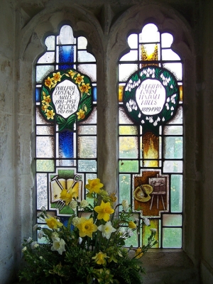 Two stained glass windows at St Peter’s church, Benington, in commemoration of William Eustace Mills 1881-1957 and Everilda Tindall Mills 1889-1992; a Flickr photo